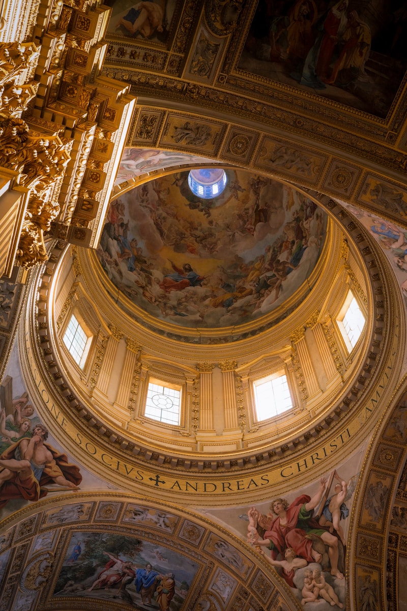 The ceiling of a building with paintings on it